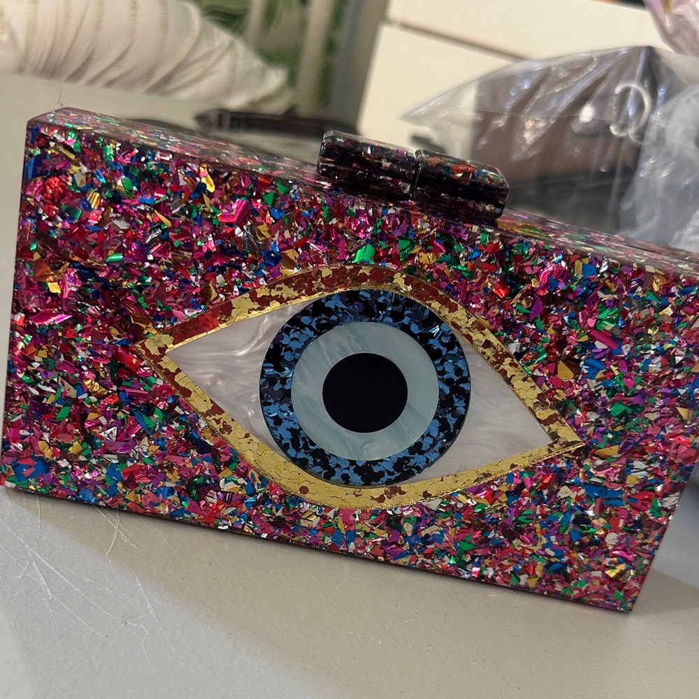 Compact Evil Eye Bag – Fits Cellphone
$20